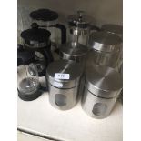 4 glass cafetieres and 5 matching stainless steel storage jars