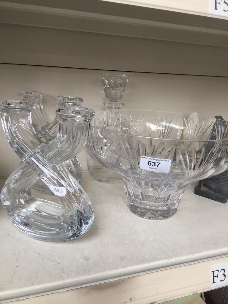 A crystal bowl, decanter, and a pair of x shaped glass candle holders