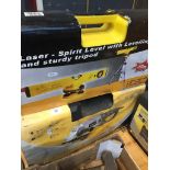 230 mm angle grinder in box and a laser spirit level with tripod.