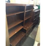 Three of bookcases with lower cupboards