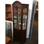 A corner display cabinet and a small 2 door cabinet