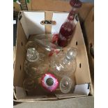 A box of antique glassware, matchstrikers, decanters, etc.