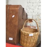 A Revalation suitcase and a wicker basket