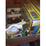 A box of Thomas the Tank trains, etc.