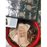 A box of world coins and banknotes