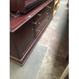 A large modern mahogany sideboard