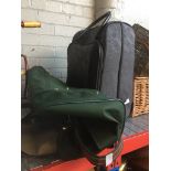 A suitcase and a travel holdall