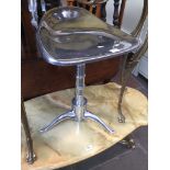 An adjustable chrome stool