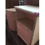 A woven bedside cabinet and woven corner linen basket