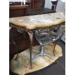 An Italian vintage onyx top console table with gilt metal base.