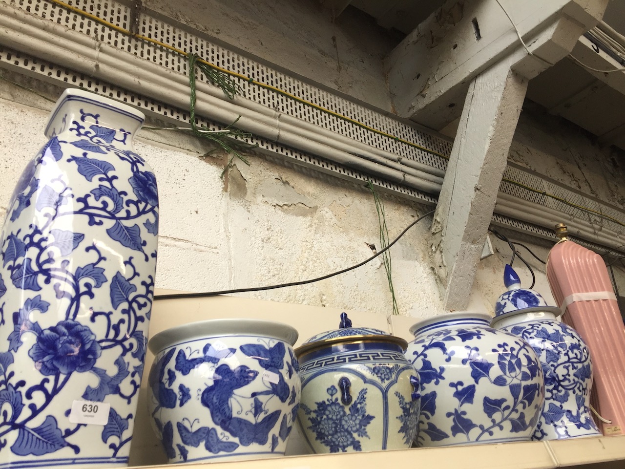 Five pieces blue and white pottery including planters, ginger jar and vase