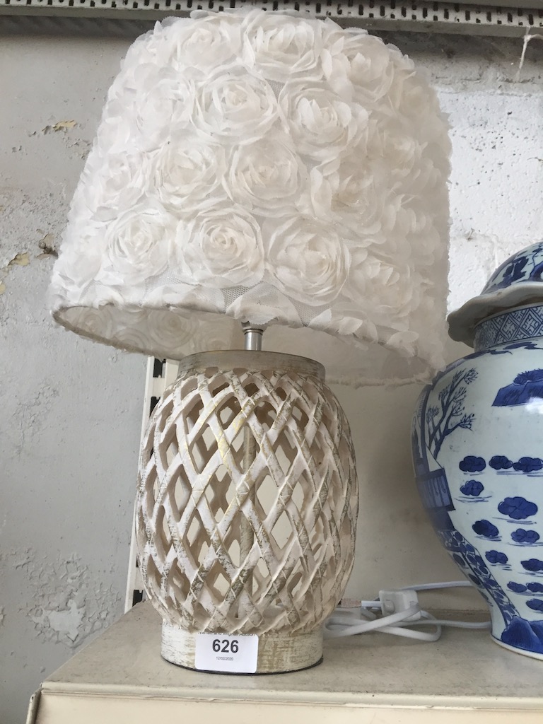 A cream table lamp with shade