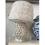 A cream table lamp with shade