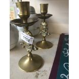 Pair of bulldog brass candlesticks