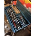 A metal toolbox with contents