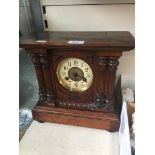 A 19th century walnut mantle clock.