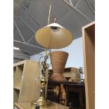 A brass effect reading lamp