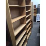 A pair of light oak bookcases