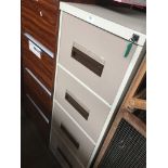 A large metal 4 drawer filing cabinet