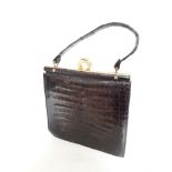 A vintage crocodile leather handbag.