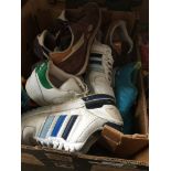 A box of Adidas, Nike, Reebok trainers - mainly size 9