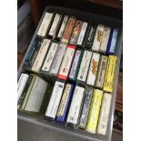 A box of 8 track stereo cassettes.