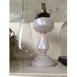 A milk glass oil lamp