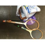 2 tennis rackets and a badminton racket.