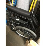 A folding wheelchair