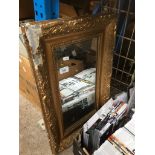 a gilt framed mirror - As found