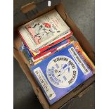 A box of football and rugby programmes