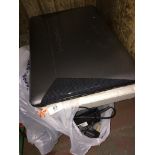 A Medion Akoya laptop with Windows 7, Intel Core i3 processor with charger lead, together with an