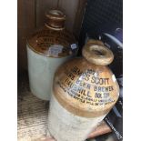 Two advertising stoneware bottles