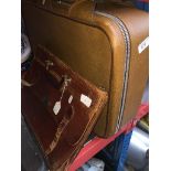 A vintage brief case and a suitcase