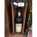 A Dow's 10 yr old 750ml bottle of port in presentation box, unopened and sealed.