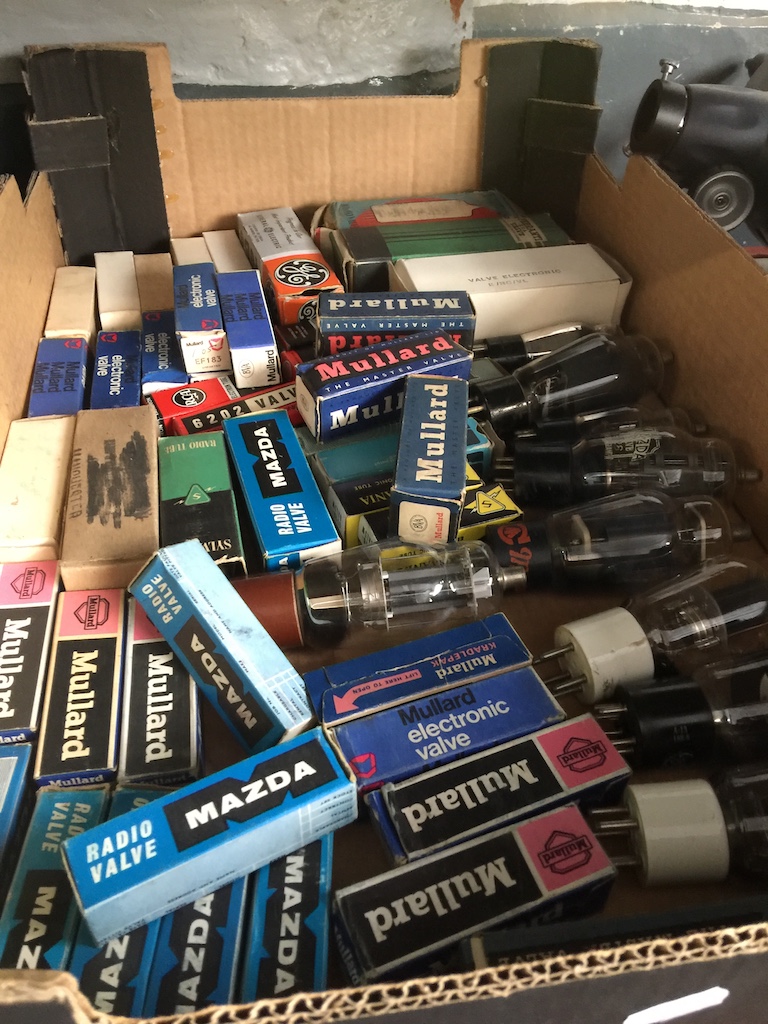 A box of vintage valves, various sizes, some boxed.