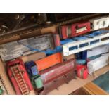 A box of play worn Dinky trucks and vans