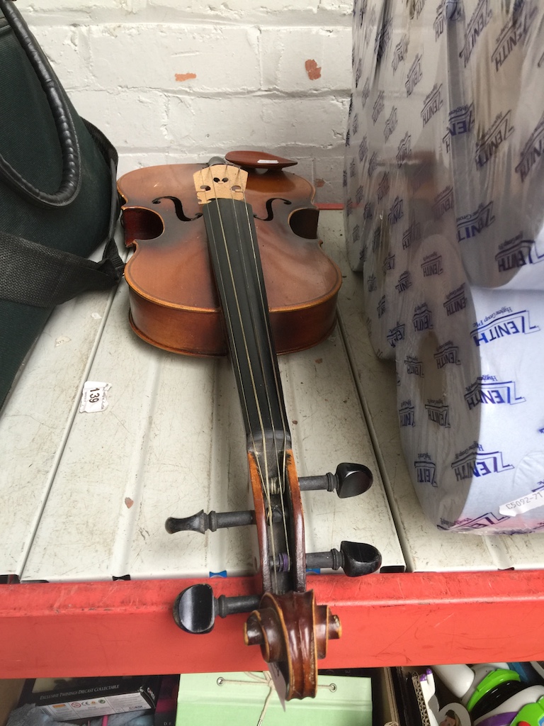 A student violin bearing strad. label.