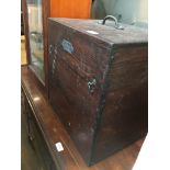 A wooden storage chest and contents