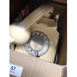 A cream vintage bakelite telephone