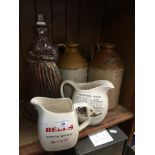 Two whisky jugs and two stoneware flagons.