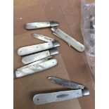 A quantity of hallmarked silver and mother of pearl fruit knives