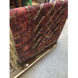 A red and brown, hand knotted geometric pattern eastern runner, 180cm x 100cm.