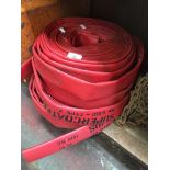 Three rolls of fire hose