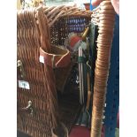 A wicker picnic hamper with a few items inside