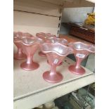 A set of six retro 1960s pink glass fruit dishes.