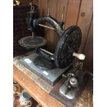 Two vintage sewing machines - one miniature