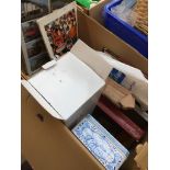 A mixed box containing tins, viewfinder with slides, books and leaflets