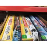 A box containing 7 Monopoly games