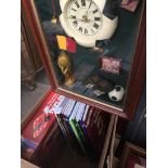 A box of books and a clock depicting the history of soccer